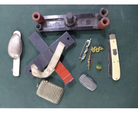 A MILITARY HELMET PLATE, PENKNIFE, BADGE, VESTA CASE AND A FOLDING SPOON 