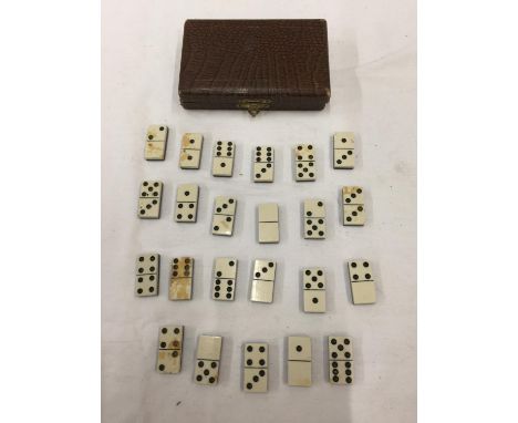 A BOXED VINTAGE INCOMPLETE MINIATURE SET OF BONE DOMINOES 