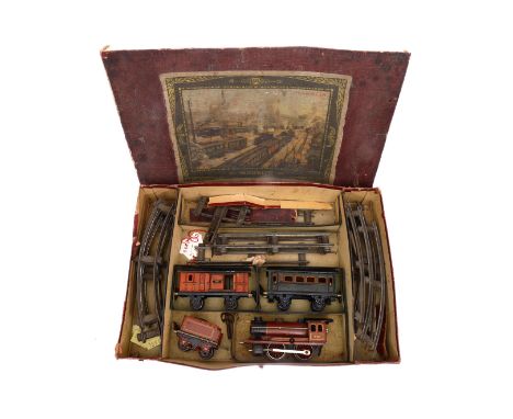 Märklin Zugpackung, Spur 0, Uhrwerk intakt, gefüllt mit B-Dampflok R 950, Tender, 2 Wagen und Schienenmaterial, OK besch. und