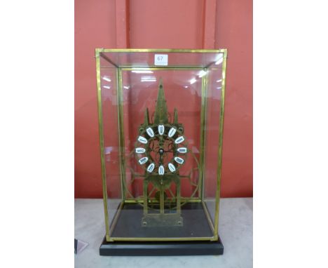 A brass architectural skeleton clock, cased