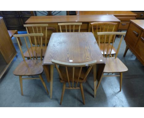 An Ercol drop-leaf table and six chairs