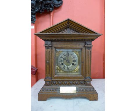 An oak cased bracket clock with a Junghans movement