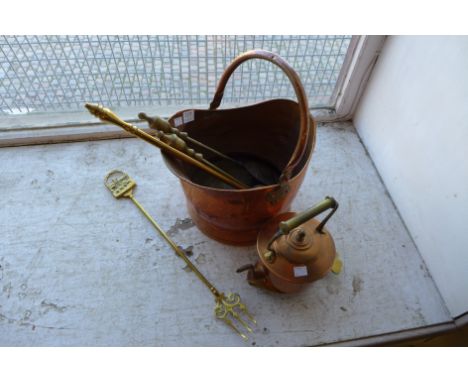 A copper coal bucket, fire irons, toasting fork, trivet and copper kettle