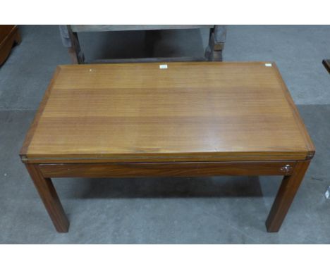 A teak fold-over card table/coffee table