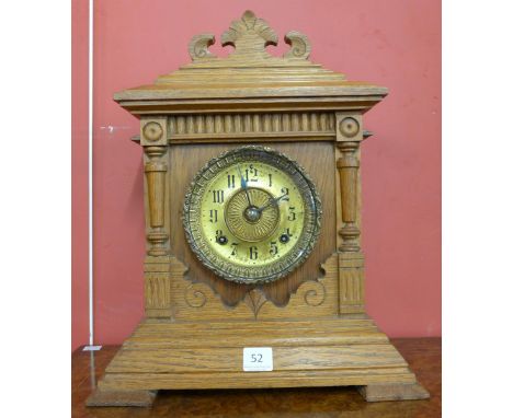 An American oak cased Ansonia bracket clock