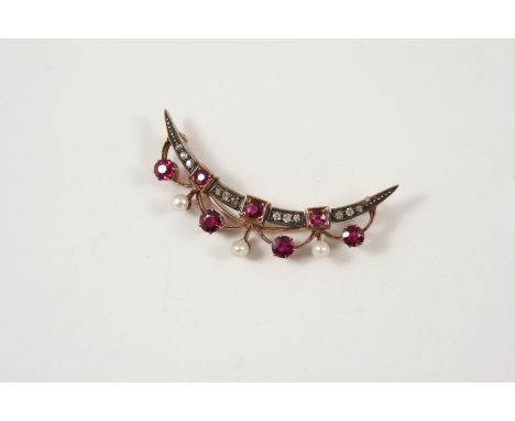 A RUBY, PEARL AND DIAMOND CRESCENT BROOCH the open crescent is set with rose-cut diamonds, circular rubies and small pearls, 