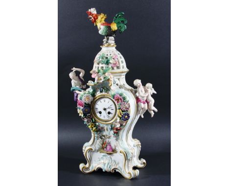 MEISSEN MANTEL CLOCK,  late 19th century, of rococo form applied with flowers, a maiden, cherubs and a cockerel, twice cancel