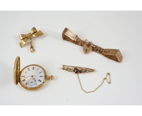 A 9CT. GOLD GATE LINK BRACELET with padlock clasp, 12.7 grams, together with a 15ct. gold brooch, set with pear-shaped garnet