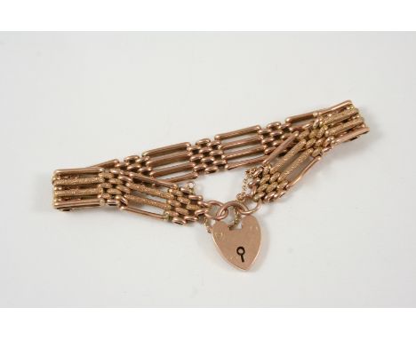 A 9CT. GOLD GATE LINK BRACELET with padlock clasp, 19cm. long, 16.7 grams.