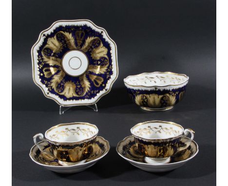 ENGLISH PORCELAIN PART SERVICE, probably H & R Daniel, with yellow and gilt foliate decoration on a cobalt ground, comprising