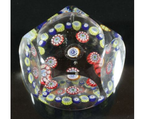 FACETED MILLEFIORI PAPERWEIGHT,  probably St Louis, a central cane inside a ring of five canes and a further outer ring, diam