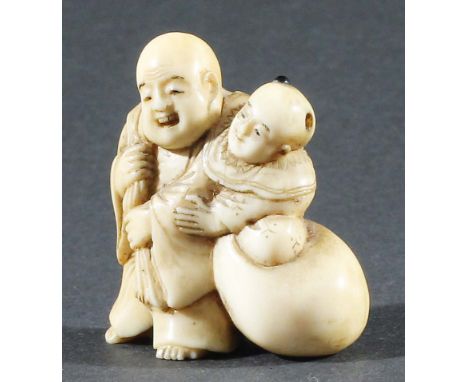 JAPANESE IVORY NETSUKE, carved as a man and boy with a sack, stone inset top knot