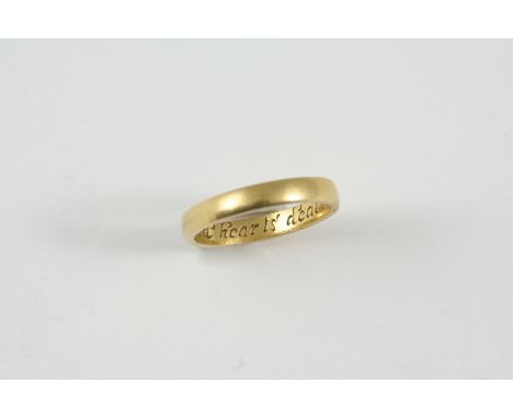 A GOLD POSY RING inscribed to the inside United hear ts death only parts. Size N.