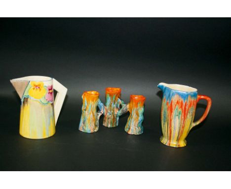 CLARICE CLIFF including a Delecia jug with drip effect glaze, a jug with a triangular shaped handle, and an unusual triple sp