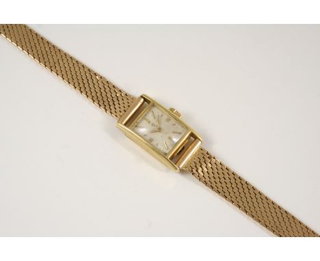 A LADY'S GOLD WRISTWATCH BY CYMA the signed rectangular-shaped dial with baton numerals, on a gold bracelet with ladder clasp