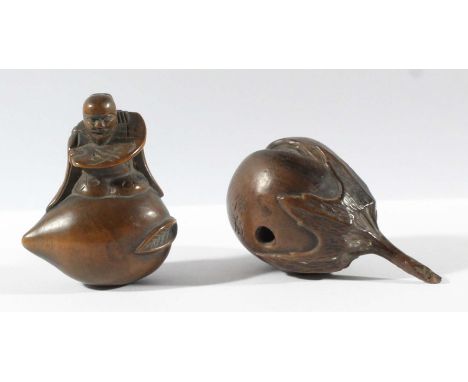TWO JAPANESE WOOD NETSUKE, one as a man seated on a gourd, the other as a splitting fruit, both signed (2)