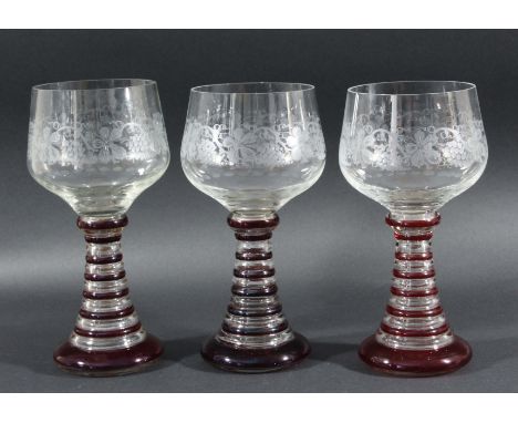 SET OF SIX OVERSIZED WINE GOBLETS, Bohemian style, the clear glass bowls with fruiting vine engraved decoration on banded cle