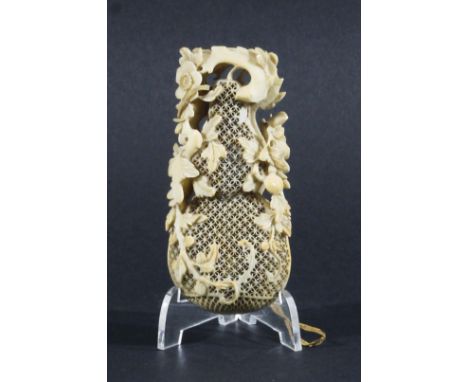 CHINESE RETICULATED IVORY POMANDER, early/mid 19th century, of double gourd form, with scrolling floral decoration, height 11