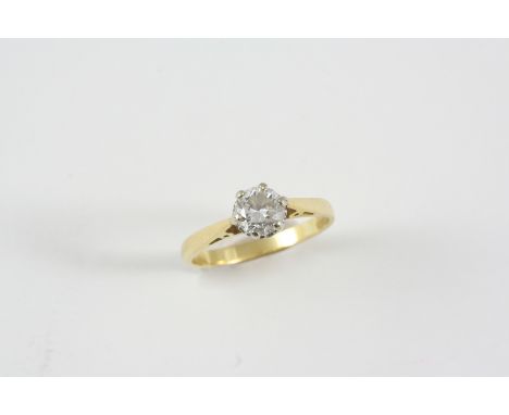 A DIAMOND SOLITAIRE RING the old brilliant-cut diamond weighs approximately 0.75 carats and is set in 18ct. gold. Size M 1/2.