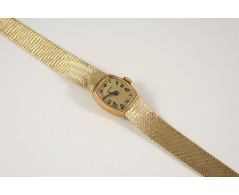 A LADY'S 9CT. GOLD WRISTWATCH BY ETERNA the signed oval shaped dial with Roman numerals, on an integrated bracelet with ladde