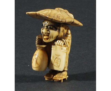 JAPANESE IVORY NETSUKE, carved as a sake seller beneath a lotus leaf hat, with a moving tongue, unsigned, height 4cm