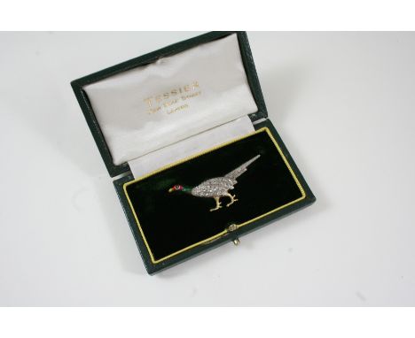 A DIAMOND AND ENAMEL PHEASANT BROOCH realistically formed, the body set with rose-cut diamonds, the head with enamel decorati