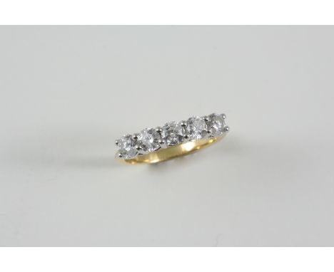 A DIAMOND FIVE STONE RING the five brilliant-cut diamonds weigh 1.51 carats in total and are set in 18ct. gold. Size P.