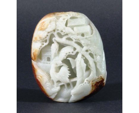 CHINESE BOULDER CARVING, the celadon stone with russet edges carved with a figure, exotic birds, buildings and foliage, heigh