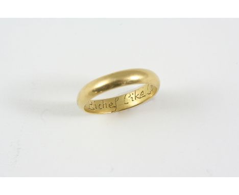 A GOLD POSY RING inscribed to the inside No riches like content. Size U.