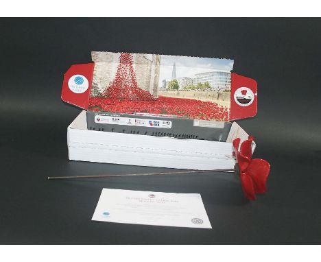 CERAMIC POPPY - PAUL CUMMINS  a ceramic poppy, designed by Paul Cummins and made for the art installation at the Tower of Lon