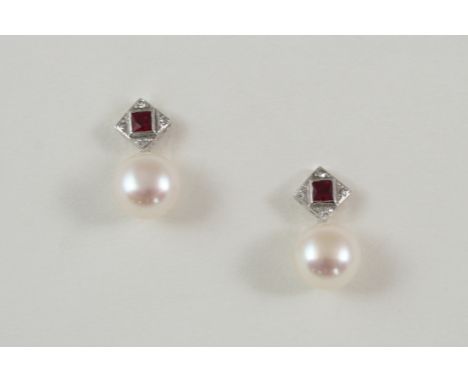 A PAIR OF CULTURED PEARL AND RUBY DROP EARRINGS each set with a cultured pearl with ruby and diamond set surmount, in 18ct. w