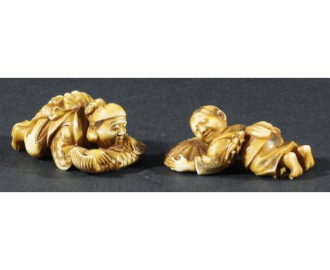 TWO JAPANESE IVORY NETSUKE, carved as a man resting on a fish and another resting on a basket, signed (2)