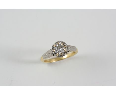 A DIAMOND SOLITAIRE RING the circular brilliant-cut diamond is set in 18ct. gold and platinum. Size N.