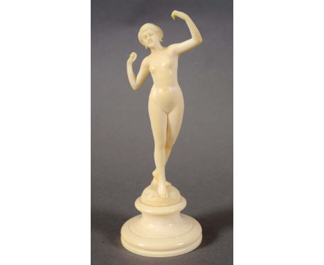 ART DECO IVORY FIGURE OF A LADY an ivory Art Deco figure of a lady, the figure with arms outstretched and mounted on an ivory