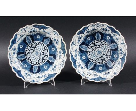 PAIR OF WORCESTER DISHES, circa 1770-75, blue painted in the K'ang Hsi Lotus pattern inside a wavy rim, K'ang Hsi mark, diame