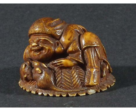 JAPANESE IVORY NETSUKE, carved as a man and rats on a hat, signed