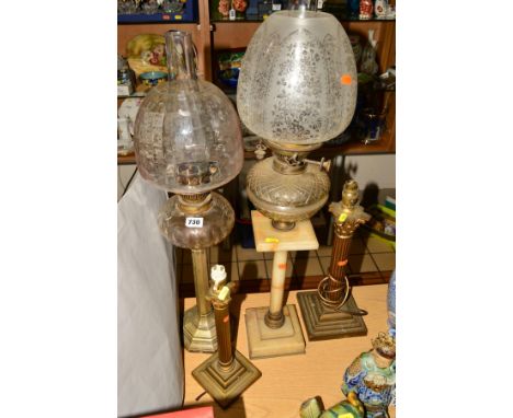 A SILVER PLATED OIL LAMP, marked Hawksworth Eyre &amp; Co, with glass reservoir, shade and funnel, total height 70cm, an alab