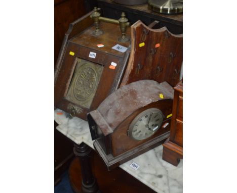 AN EDWARDIAN OAK AND BRASS PURDONIUM, mahogany wall mounted game and a mantel clock (sd) (3)