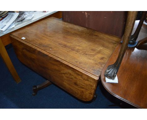 AN EARLY 19TH CENTURY MAHOGANY DROP LEAF RECTANGULAR OCCASIONAL TABLE, fitted with an end drawer and dummy drawer, on a turne