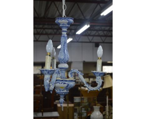 A PAIR OF BLUE AND WHITE CERAMIC TRIPLE BRANCH CEILING LIGHTS