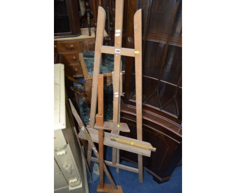 A BEECH FOLDING ARTISTS EASEL together with four various measuring tools (5)