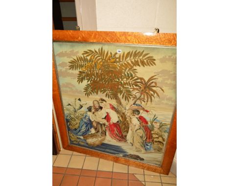 A VICTORIAN TAPESTRY OF THE DISCOVERY OF MOSES IN THE BULLRUSHES, in a birds eye maple frame and glazed, tapestry 111.5cm x 9