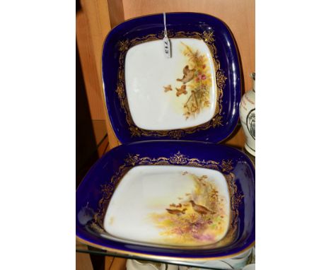 TWO ROYAL WORCESTER SQUARE SHAPED DISHES, decorated with grouse and with blue and gilt rims, puce factory marks and 6366 to b