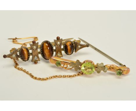 TWO EARLY 20TH CENTURY BROOCHES, the first believed to be 9ct gold, set with a central circular green paste and two smaller g