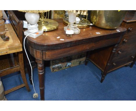 A GEORGIAN MAHOGANY FOLD OVER CARD TABLE with turned legs and cross banding to edges, width 88cm x depth 45cm x height 74cm (