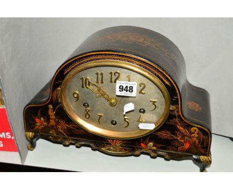 A WOODEN VENEERED FOOTED MANTLE CLOCK, painted with floral and chinoserie decoration, silvered oval dial, having gilt metal A
