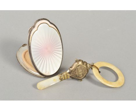 A GEORGE V SILVER AND PINK ENAMEL POWDER COMPACT, of oval form, chipped, engraved initials to engine turned base, Birmingham 