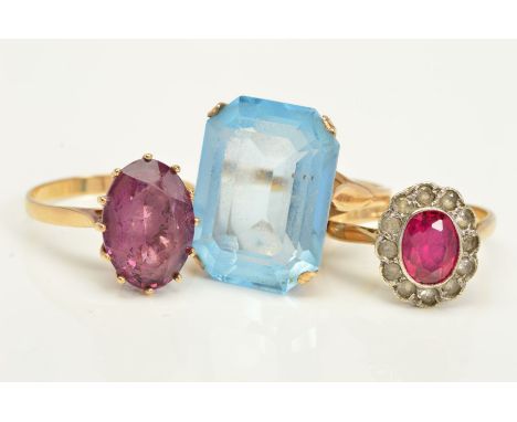 THREE DRESS RINGS, the first a rectangular blue paste in a four claw setting, stamped 9ct, the second a 9ct gold amethyst rin