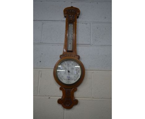 AN EDWARDIAN LIGHT OAK ANEROID BAROMETER