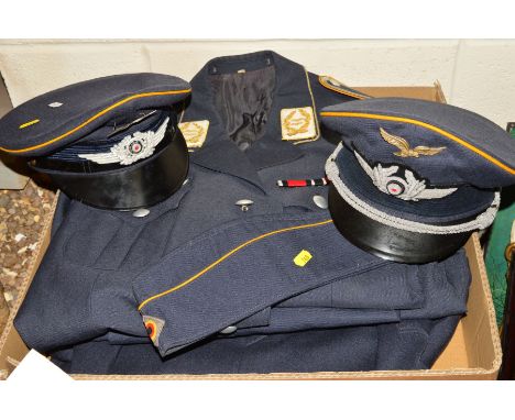 THREE UNIFORM JACKETS IN THE STYLE OF WWII GERMAN LUFTWAFFE WITH HEADGEAR AS FOLLOWS (a) Uniform jacket, Luftwaffe shoulder a